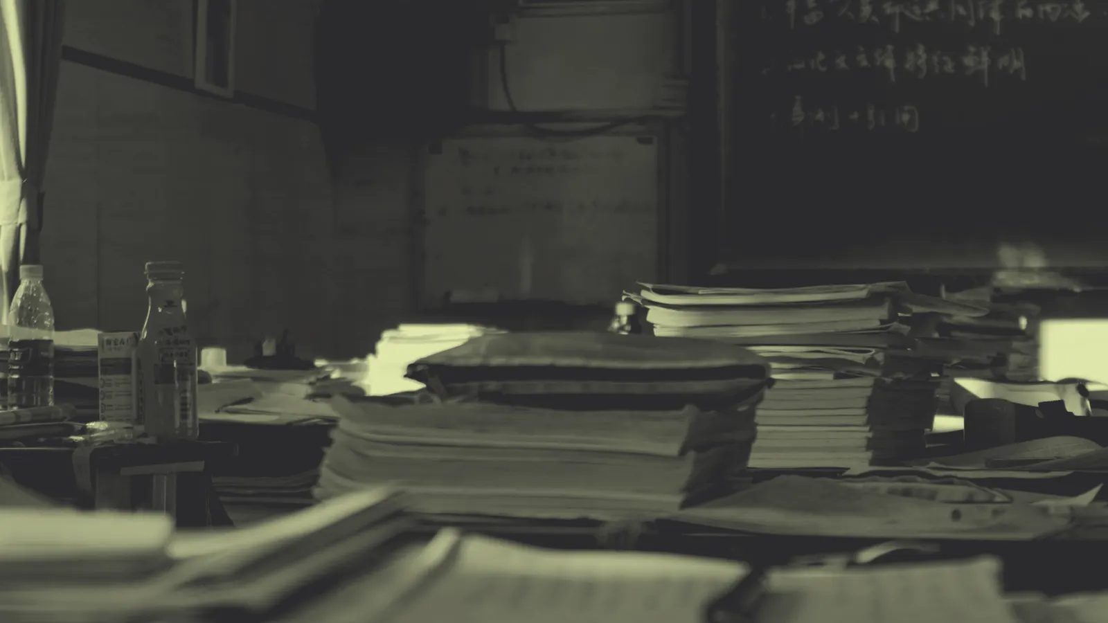 Piles of paper resumes and documents on office desks, the problem applicant tracking systems were built to solve